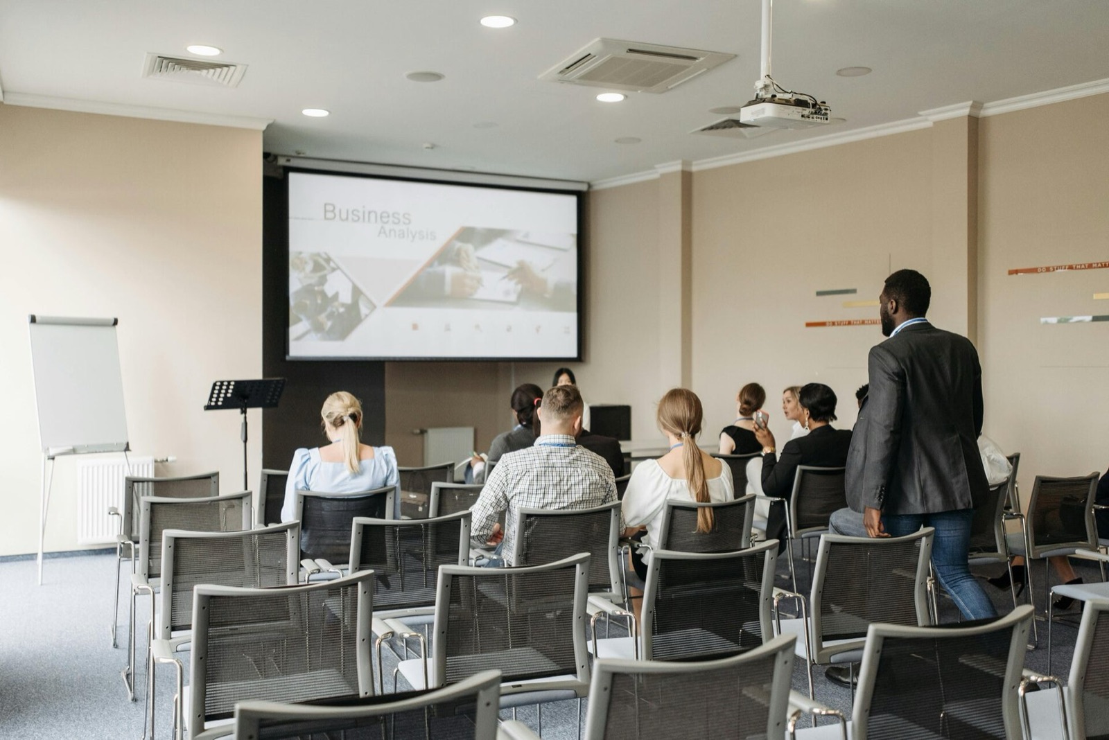 Delegates seated in a training room during a presentation